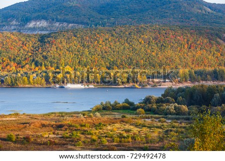 Peaceful autumn landscape. View from the top of the hill. Zhigulevskie mountains and volga river on the picture.