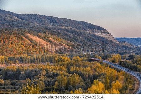 Peaceful autumn landscape. View from the top of the hill. Zhigulevskie mountains and volga river on the picture.
