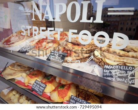 Neapolitan Street food stand. Calzone fritto, Pagnottiello and Pizza among the traditional dishes offered for sale Royalty-Free Stock Photo #729495094