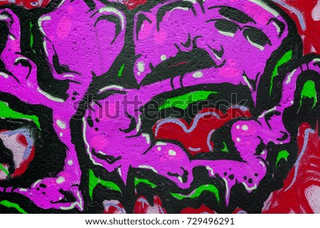 Art under ground. Beautiful street art graffiti style. The wall is decorated with abstract drawings house paint. Modern iconic urban culture of street youth. Abstract stylish picture on wall