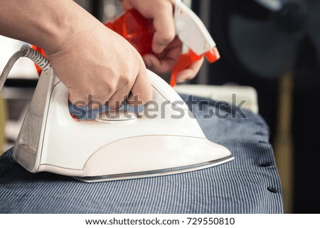 Ironing with iron,Bored home work