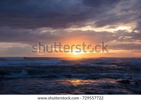 Sea scape waves sunset light glow and cloudy sky