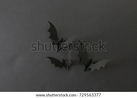Halloween background with bats on a black background. An empty space to insert text.