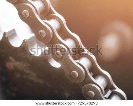 close up shot of metal chain on the machine gear