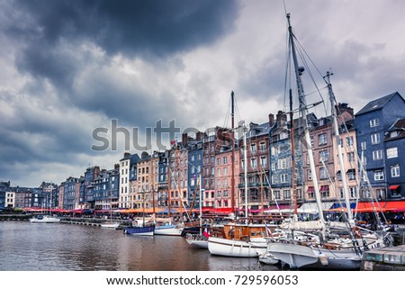 Honfleur, Normandy, France. Boats and colored buildings
