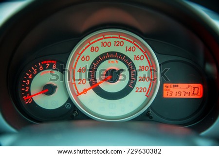 Car speedometer panel.Speedometer of a vehicle.Close up image of car speed dashboard with light illuminated. Royalty-Free Stock Photo #729630382