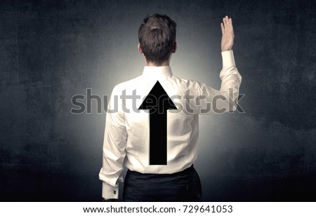 Young businessman standing and thinking about which direction to choose