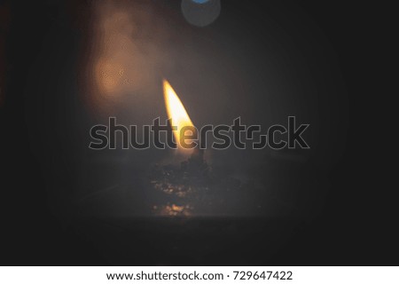 Flames burning candles in the temple