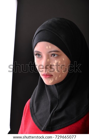 Beautiful woman face with foundation beauty is pain