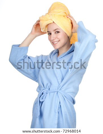 smiling young woman in bathrobe and yellow towel on head, series
