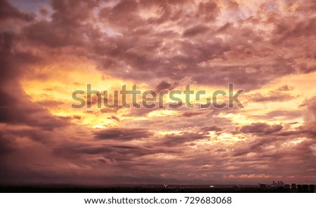 Beautiful Mountain Sunset with City Skyline in Distance and Pink Orange Clouds