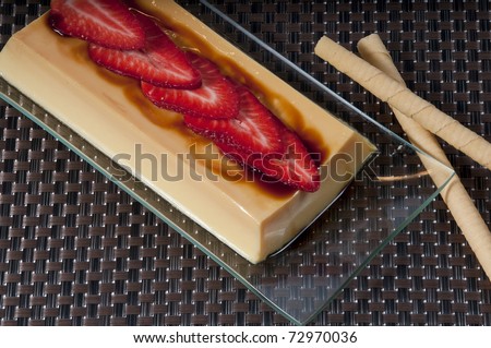custard picture with strawberries and rolled wafers