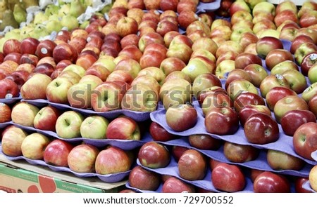 Apples for sale at a sidewalk market. 