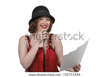 Woman speaking into a vintage microphone performing a radio play