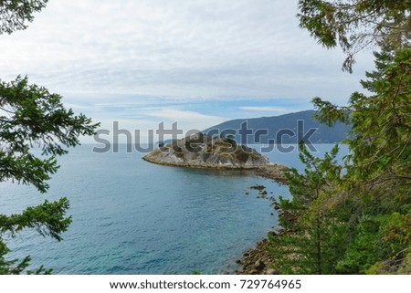 A small island in the middle of the ocean in West Vancouver, British Columbia, Canada.