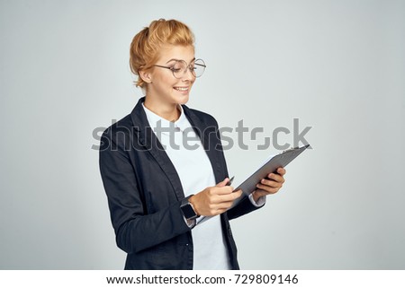 business woman looking at documents on gray background                               