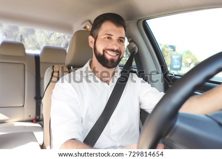Man on driver's seat of car Royalty-Free Stock Photo #729814654