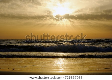 sunset and sky and sea and waves and clouds on the Mediterranean Sea in Israel