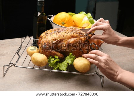 Woman preparing composition for photographing food in studio