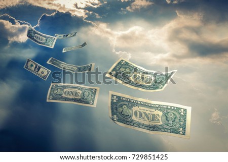 Dollar bill flies in the sky It represents the acquisition and loss of money.
