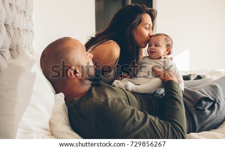 Happy Parents Playing With Their Son On The Bed Stock Photos And Images Avopix Com Happy Parents Playing With Their Son On The Bed Stock Photos And Images Avopix Com
