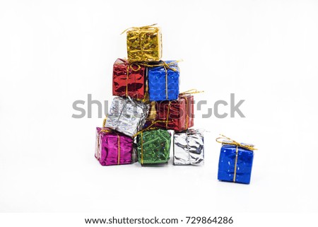 Small decorative presents on white table with.  Macro photo.