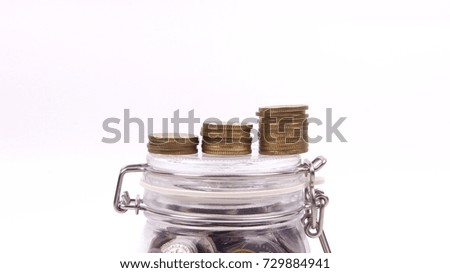 Coins stacked increment shape on coin jar. Business and financial concept