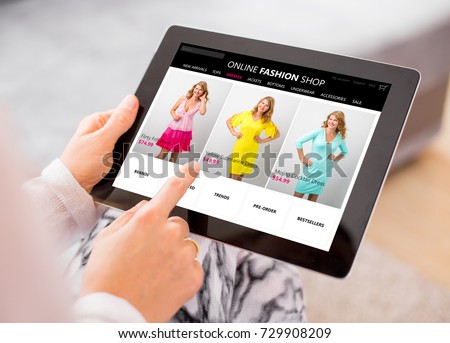 Woman shopping online for new dress.  All content is made up. Royalty-Free Stock Photo #729908209
