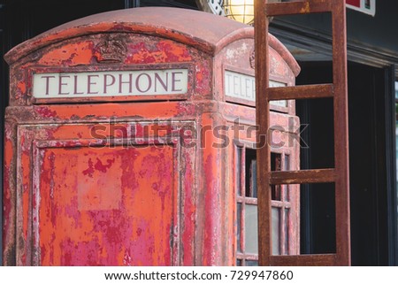 Abandoned British red public telephone box.