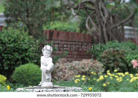baby statue in the garden.