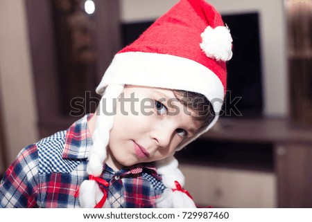 cheerful boy in a red cap