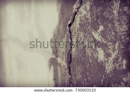 blurred abstract texture background, out of focus grunge wall toned, big crack