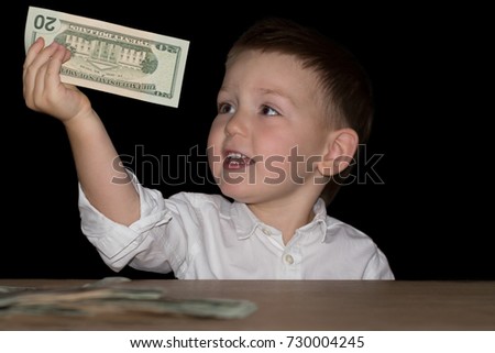 Happy Boy with Dollars in Hands