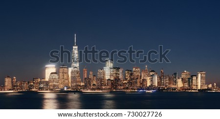 New York City skyline with skyscrapers over Hudson River viewed from New Jersey at night