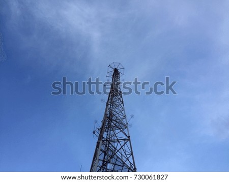 a signal/coverage tower with skyline background (communication)
