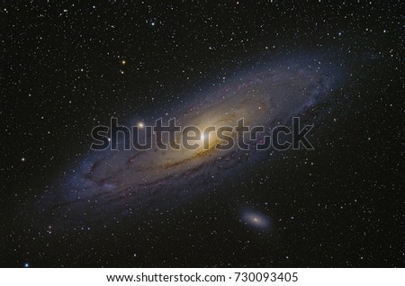 M31 Andromeda Galaxy with Nebula ,Open Cluster,Globular Cluster, stars and space dust in the universe. Royalty-Free Stock Photo #730093405