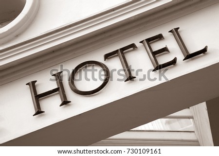 Hotel Sign on Building Facade in Black and White Sepia Tone