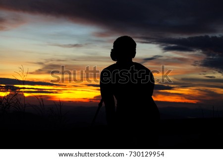 photographer in sunset