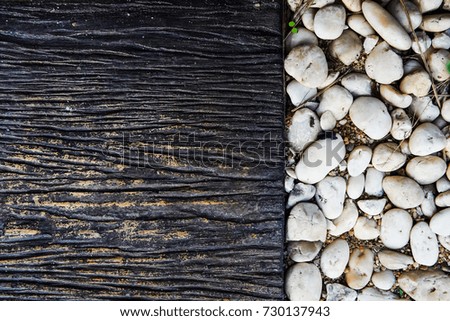 White pebble stone floor texture and stone block tile for the pathway , background concept.