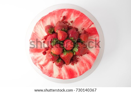Cake red velvet with whipped red cream, fresh strawberries. Picture for a menu or a confectionery catalog. Top view.