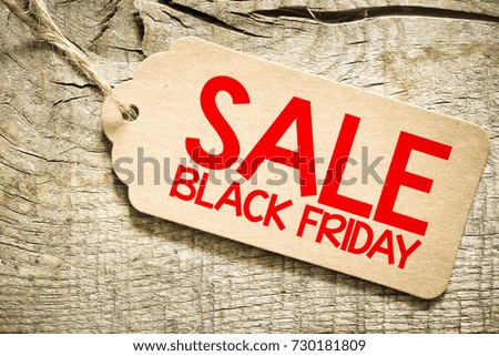 Sale black friday tag on wooden background