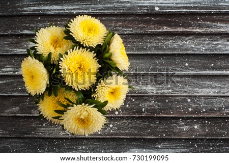 Yellow daisies, copy space on old wooden background