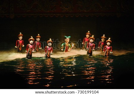 Traditional Vietnamese water puppet show in Hanoi, Vietnam. Royalty-Free Stock Photo #730199104