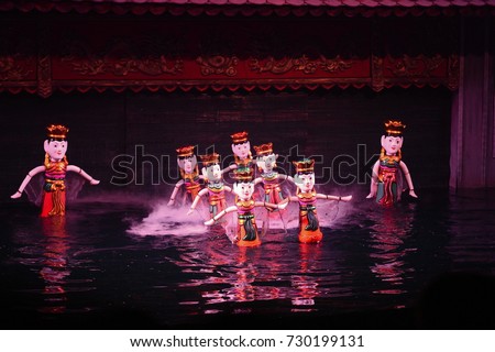 Traditional Vietnamese water puppet show in Hanoi, Vietnam. Royalty-Free Stock Photo #730199131