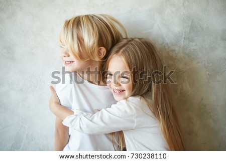 Beautiful Little Girl With Long Hair Blonde On A White Background