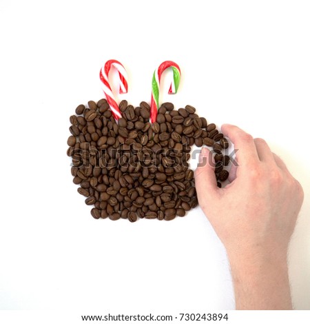 Concept Silhouette Christmas Beverage Coffee Beans Cup Cocoa Candy Cane Male Hand Hold White Background Top View Square