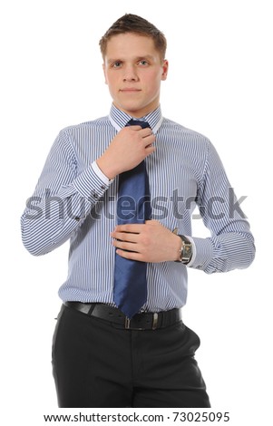 picture of a businessman adjusting his tie. Isolated on white background