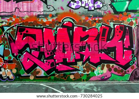 Art under ground. Beautiful street art graffiti style. The wall is decorated with abstract drawings house paint. Modern iconic urban culture of street youth. Abstract stylish picture on wall