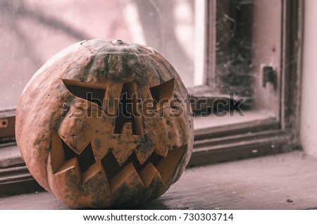 Pumpkin for Halloween, lamp pumpkin, antique wood, celebrating halloween, smiley on a pumpkin, autumn dry leaves, bright background, funny and angry face.