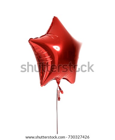 Single big red star balloon object for birthday  party isolated on a white background